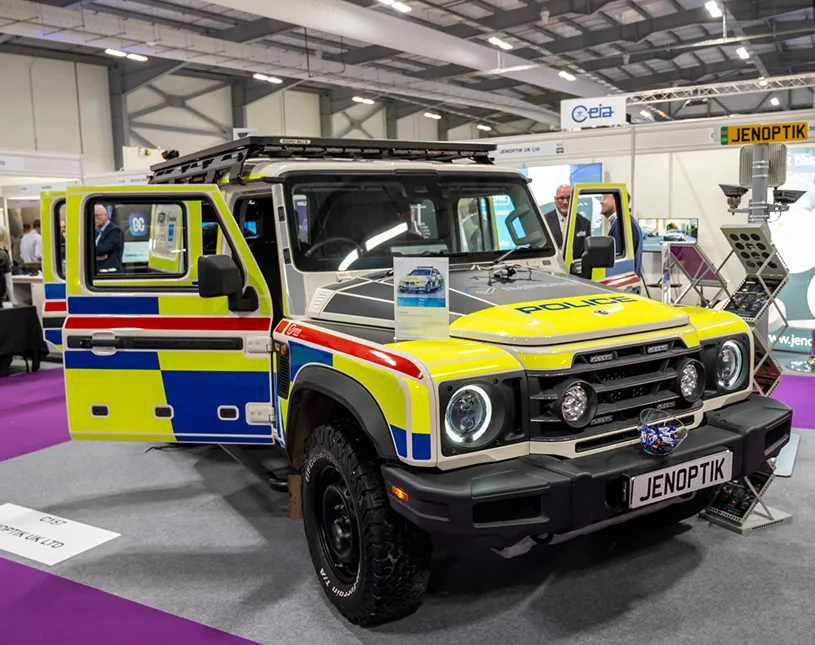 Marked emergency vehicles on display in the Security & Policing exhibition hall.