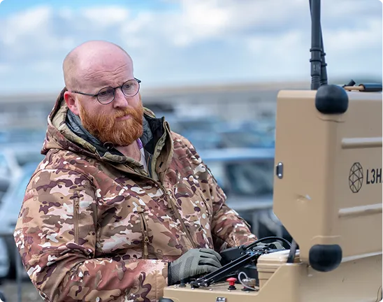 An operator uses control equipment during an outdoor counter-threat demonstration.