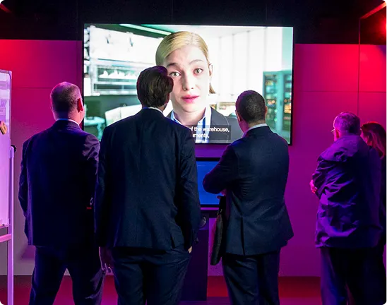 Visitors watch a large video screen in the Immersive Experience at Security & Policing.